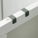 Two gray metal Multi-Purpose Hooks from Lovely Home Icon, featuring a space-saving hanger design, securely hold a panel or board. A red line and “2cm” label indicate the maximum board thickness they accommodate. The hooks are displayed against a simple, light-colored background.