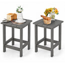 Two gray DirectDeals Square Adirondack Side Table 14″ Weather-Resistant HDPE models hold food and drinks—one displays bread, a cup, and a vase; the other holds a basket with a baguette and yellow-white flowers.