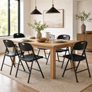 A modern dining room with a wooden table, DirectDeals Foldable Plastic Dining Chairs Set of 6 with Ergonomic Backrest, neutral decor, two pendant lights, minimalist plants, and large windows for natural light.