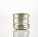 Three stacked, round Shave Bowls by The Immaculate Beard—with a greenish glaze and earthy tones—are set against a plain white background on a reflective surface, highlighting their handmade appeal for your favorite shave soap puck.