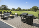 Modern patio with outdoor seating around a fire pit, a BBQ Boards® Blackstone Pellet Grill Combo Front or Side Cutting Board by BBQ Boards® at the grill prep station, and views of a vibrant golf course under a clear blue sky.