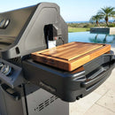 The BBQ Boards® Napoleon Prestige 500 Side Cutting Board by BBQ Boards® provides ideal grill prep space with its built-in cutting board and control knobs, perfect for summer gatherings near the pool or with a scenic view.