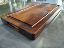 The BBQ Boards® Traeger Ironwood Front Cutting Board by BBQ Boards® features a two-tone wood grain, smooth finish, and a recessed slot for its matching tray, making it an ideal BBQ prep station on any surface.