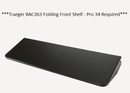 The BBQ Boards® Traeger Pro 34 Front Cutting Board is a black accessory designed for the Traeger 34 Series, shown on a white background.