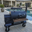 A pair of BBQ Boards® Yoder YS1500 Front & Pellet Bin Cutting Boards by BBQ Boards® are set up on a large black Yoder Smokers grill by the pool, with a modern house and outdoor dining area in the background.