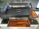 Upgrade your Yoder YS640 grill with the BBQ Boards® Trio Set—three premium cutting boards for the front, side, and pellet bin—delivering a sleek, expanded workspace under your covered patio.