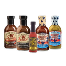 Five bottles from Bear & Burton's Ultimate Sauce Bundle—including W Sauce, Fireshire, America’s Worcestershire, Special Reserve Hot Sauce, and Breakfast Sauce—are arranged side by side on a white background.