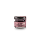 A 1.5 oz glass jar of Bourbon Barrel Foods Black Raspberry Jam, featuring a black lid and a purple “Kentucky Grown | Appalachia Made” label, highlights rich Appalachian fruit flavor against a plain white background.