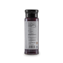 A glass bottle of Bourbon Barrel Foods Black Raspberry Jam with a black lid is shown from the back, featuring a nutrition facts and ingredients label that’s mostly unreadable due to small text.