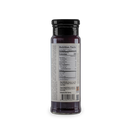 A clear glass bottle with a black cap holds Bourbon Barrel Foods Blueberry Bourbon & Cardamom Jam, showing nutrition facts and ingredients on the back. The bottle contains dark purple jam and is set against a plain white background.