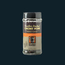 A clear plastic jar of Bourbon Barrel Foods Bourbon Smoked Cacao Nibs from Louisville, KY, with orange and black accents, displays dark nibs inside—ideal for baking or adding a superfood boost to your favorite treats.