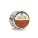 A round metal tin with a clear lid displays Bourbon Barrel Foods Bourbon Smoked Chili & Coffee Rub, revealing the reddish-brown BBQ rub inside. The cream label with black and gold accents showcases this smoky seasoning blend.
