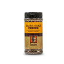 A clear plastic spice jar with a black lid labeled "Bourbon Barrel Foods Bourbon Smoked Pepper." The label has brown and orange colors, a small barrel graphic, and notes its unique smoked seasoning from Louisville, Kentucky.