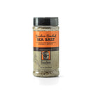 A clear plastic shaker bottle with a black lid, labeled "Bourbon Barrel Foods Bourbon Smoked Sea Salt." The orange and brown label features a bourbon barrel and the visible smoky salt, crafted in Louisville, Kentucky.
