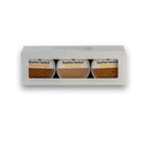 The Bourbon Barrel Foods Bourbon Smoked Sugars Trio features Orange, Vanilla, and Cinnamon sugars in a white box with a clear window—perfect for adding gourmet flavor to desserts.