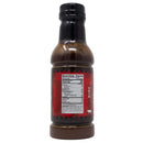 A bottle of Chicken Fried BBQ sauce with a red label is shown from the back. The nutrition facts panel is visible but hard to read—ideal for enhancing brisket bark or adding flavor to the Chicken Fried BBQ Brisket Wrap.