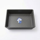 The DDR BBQ Supply 10 x 8-Inch Nonstick Baking Pan, featuring two small packets inside, is shown on a plain white background for easy cleanup after baking.