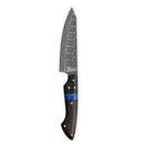 The Folded Steel Dahlia Paring Knife features an AUS10 stainless Damascus steel blade, a black handle with a blue resin accent, and multiple metal rivets. The knife is shown against a plain white background.