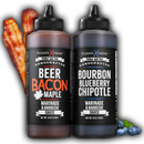 Elijah's Xtreme 2-Pack BBQ Sauce Bundle features Beer Bacon Maple and Bourbon Blueberry Chipotle sauces, with bacon strips and blueberries beside the bottles on a white background for a sweet smoky BBQ experience.