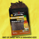 A package from Elijah’s Xtreme Beef Jerky Bulk Trio - 3 Flavors is shown on a yellow background with a bottle of habanero hot sauce. Text below reads, Hint of sweet with a habanero kick.