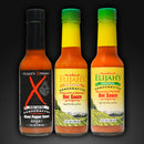 The Elijah's Xtreme Mild & Hot Trio Hot Sauce Bundle features three bottles—Ghost Pepper, Pineapple-Mango Habanero, and Original Roasted Pepper—each with a colorful label, displayed against a dark background.