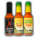 Elijah's Xtreme Mild & Hot Trio Hot Sauce Bundle displays three vibrant bottles—Ghost Pepper, Pineapple-Mango Habanero, and Original Roasted Pepper—with distinctive, colorful labels from Elijah's Xtreme.