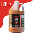 A 128 oz Elijah’s Xtreme Regret Hot Sauce Gallon, packed with Carolina Reaper and Trinidad Scorpion peppers. The black label shows a flaming skull, red text, and bold 128 oz at the top left on a white background with a red corner.