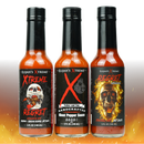 Elijah's Xtreme Trio 2.0 Hottest Hot Sauce Variety Pack features Screaming Hot, Ghost Pepper Sauce, and Regret Reserve—each bottle with skull and flame designs, perfect for extreme heat lovers.