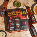 A box of Elijah's Xtreme World's Hottest Trio Hot Sauce Variety Pack, decorated with flames and skulls, sits on a marble surface next to other hot sauces and assorted food ingredients.