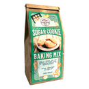 A 16 oz (454 g) brown paper bag of Fowler’s Mill Sugar Cookie Baking Mix with a green label showing sugar and festive homemade cookies.