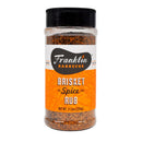 An 11.5 oz (326g) container of Franklin Barbecue’s Brisket Spice BBQ Rub, featuring an orange and white label with brand and product info; this coarse seasoning is ideal for low and slow smoking to create authentic barbecue flavor.