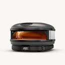 A black Gozney Arc XL Outdoor Pizza Oven with a wide front opening, interior flames, and a digital temperature display showing 950 degrees Fahrenheit.