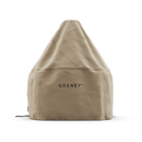The Gozney Dome Gen 2 Cover by Gozney is a beige, cone-shaped, water-repellent cover with GOZNEY branding, designed to fit over outdoor pizza ovens. It features a fitted bottom and drawstrings for secure protection.