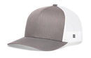 The Haka Hat Blank Trucker Hat by Haka Hat is a gray snapback with a solid front and bill, white mesh back, curved brim, structured crown, comfort-fit sweatband, and a small side tag featuring the black logo.