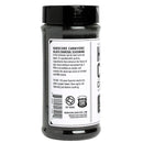 A clear plastic jar with a black lid holds Hardcore Carnivore Black Beef Seasoning—a bold red meat and BBQ rub by Hardcore Carnivore, made with activated charcoal and labeled with ingredients and usage instructions.