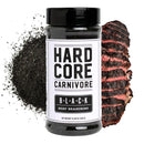 A Hardcore Carnivore BBQ Rub Sampler Set is shown with a container of seasoning, dark spice powder, and charred steak, the label clearly visible—highlighting it as a flavorful addition to any grill master's collection.