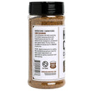 A clear plastic jar with a black lid labeled "Hardcore Carnivore Camo Game & Lamb Seasoning" is shown. Ideal for lamb or venison, its label displays usage instructions and Hardcore Carnivore branding.