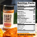 A bottle of Hardcore Carnivore Sweet BBQ Rub by Hardcore Carnivore sits next to grilled meat, showing its label and nutrition facts. Text below reads: “Not suitable for carnivore diet.”.