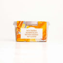 A plastic container of In The Curious Kitchen Beer Cheese 2 Pack Kentucky Original Spread, featuring an orange and yellow label that reads "Southern hospitality never tasted so good," set against a plain white background.