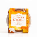 The In The Curious Kitchen Beer Cheese & Pretzels Bundle features artisan beer cheese in vibrant orange and yellow packaging—ideal for tailgate snacks or pairing with pretzels. Small batch crafted by In The Curious Kitchen since 2020.