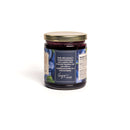 In the Curious Kitchen Bourbon Blueberry Jam by In The Curious Kitchen is a small batch jam in a glass jar with a gold lid and blue label, made from fresh Kentucky blueberries and bourbon, shown on a plain white background.