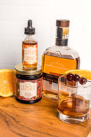 In The Curious Kitchen Orange Bitters by In The Curious Kitchen pairs perfectly with whiskey, boozy cherries, and orange slices—ideal for creating delicious bourbon cocktails at home.