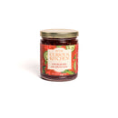 A glass jar with a gold lid labeled In The Curious Kitchen, featuring strawberries and jalapeños on a white label. Included in the In The Curious Kitchen Southern Gourmet Spread Gift Set—ideal for charcuterie boards or gifting.