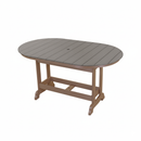 The Kanyon Living Poly Lumber 6′ Oval Outdoor Dining Table in Light Grey and Weathered Wood features a brown frame, gray slatted top, and an umbrella hole, shown against a white background.