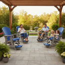 A family of four, with their dog, relaxes on Kanyon Living Poly Lumber Adirondack Glider Chairs in tall blue and light grey under a pergola on a stone patio, enjoying drinks and snacks surrounded by greenery and potted plants.