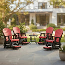 Four Kanyon Living Poly Lumber Adirondack Glider Chair Tall Red and Black surround a small table with drinks and snacks on a stone patio under string lights—ideal eco-friendly outdoor furniture from Kanyon Living.