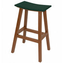 The Kanyon Living Poly Lumber Saddle Stool Bar Height in Dark Green and Cedar Wood is a weather-resistant outdoor stool with a brown frame, curved seat, and sturdy supports—ideal for patios or decks.