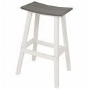 The Kanyon Living Poly Lumber Saddle Stool Bar Height Deluxe in Driftwood Grey and White features a modern design with a curved dark gray seat, white legs, and footrests on all sides—ideal for stylish coastal outdoor seating.