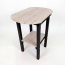 The Kanyon Living Poly Lumber Tall Oval Side Table in Seashell and Black features a light wood-look top, black legs, and a matching lower shelf, shown against a plain white background.