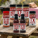 The Killer Hogs BBQ Rub and Sauce Complete Gift Set from Killer Hogs features six BBQ rubs and two sauces on a wooden table with a grill and checkered cloth—perfect for backyard cooks.